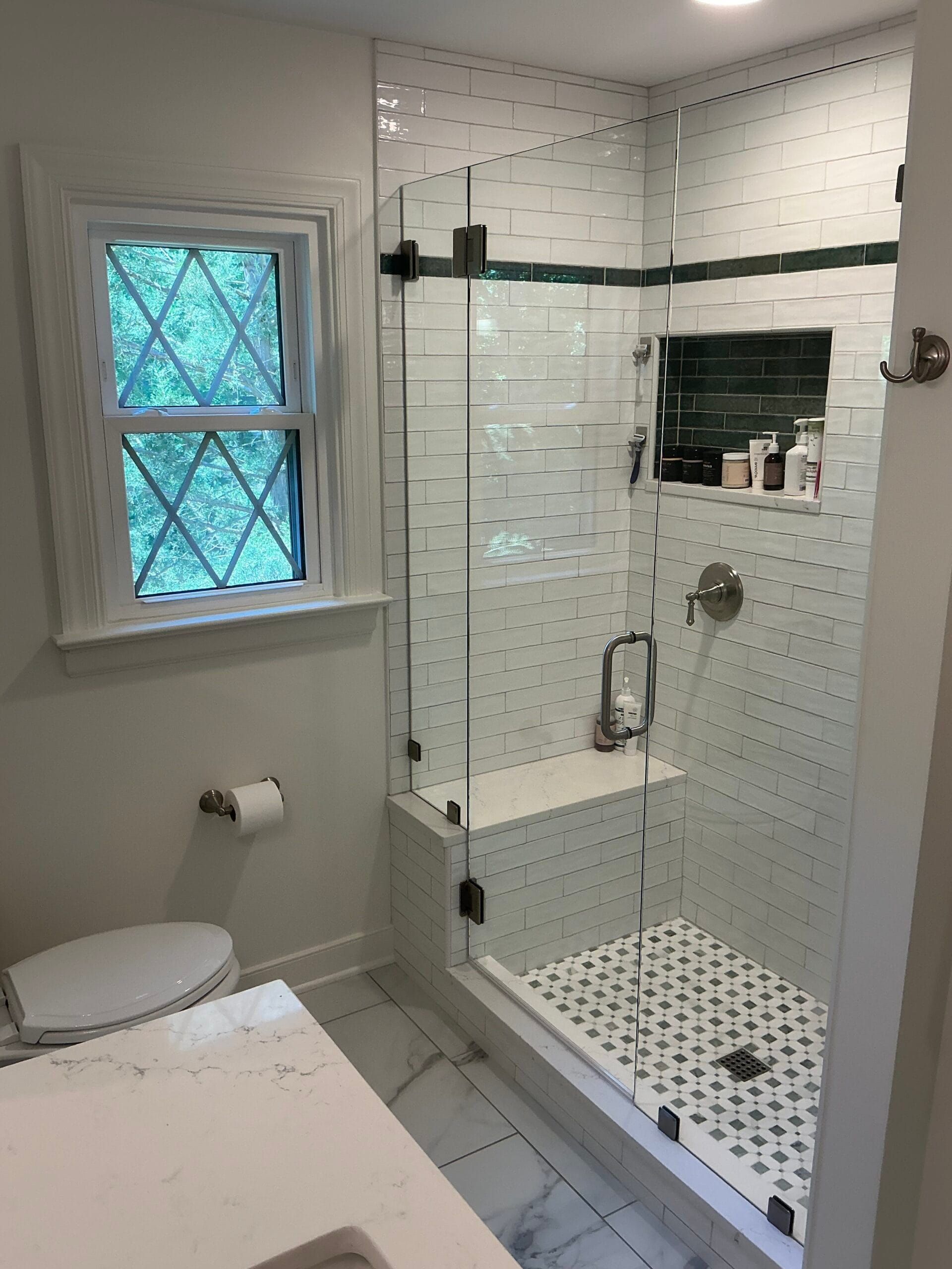 A glass-to-glass shower door