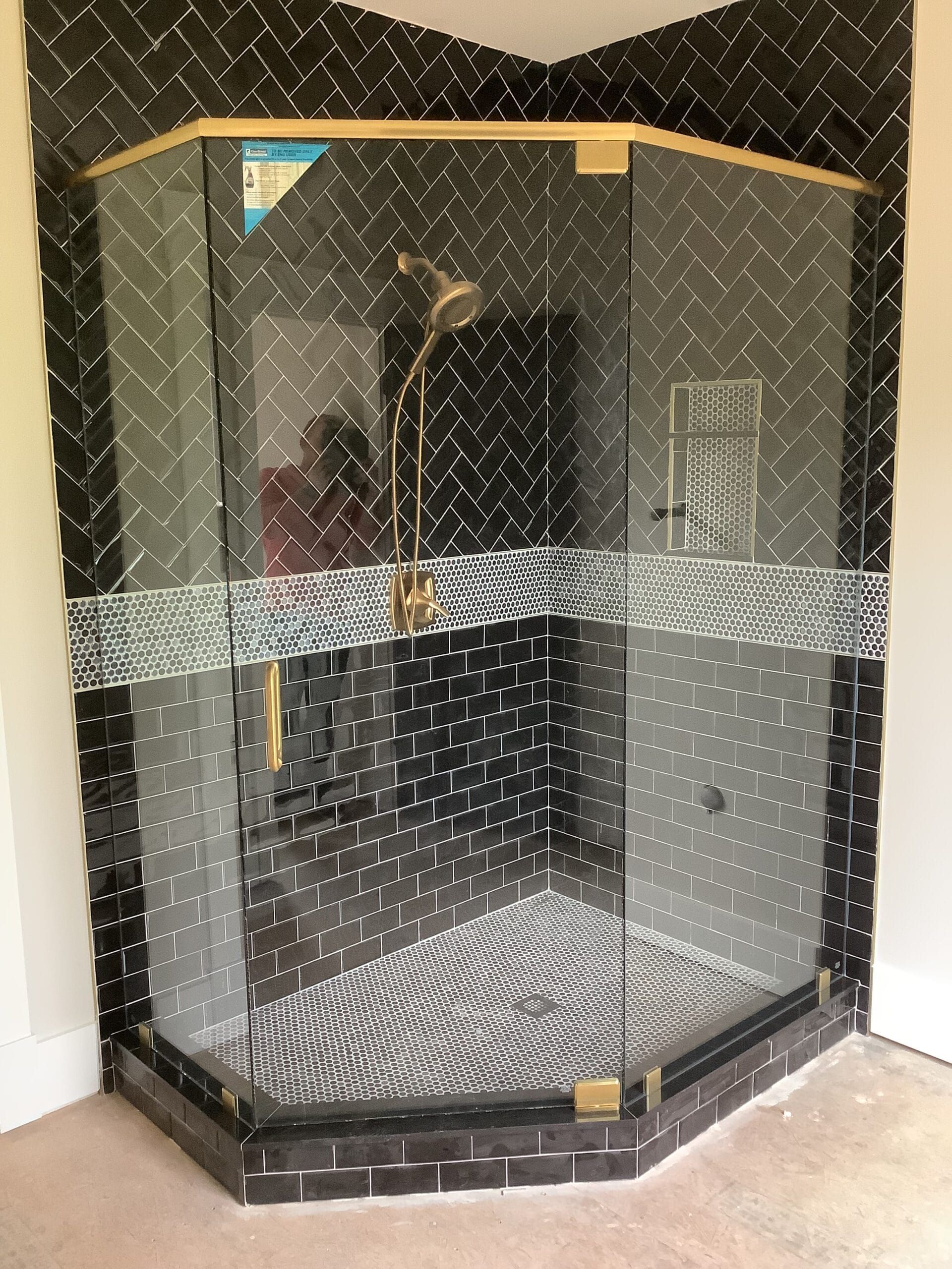 A gold shower door header system